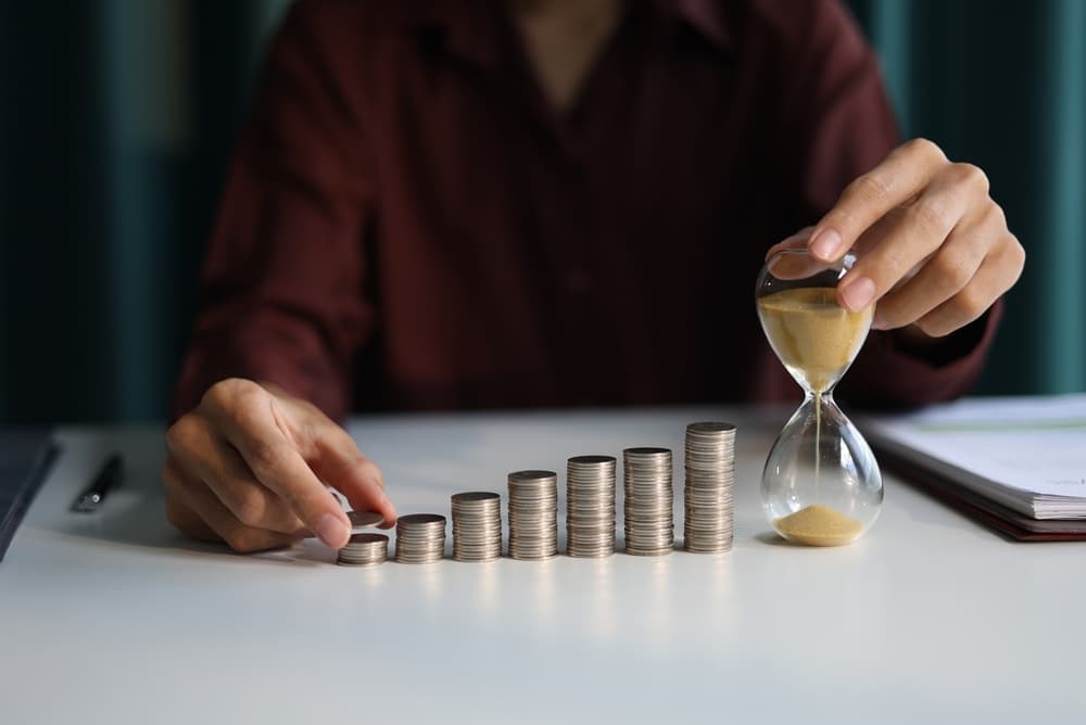money stacking up in coins on a table