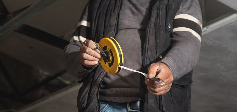 man holding measuring tape